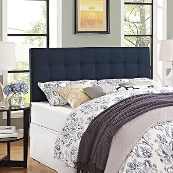 Navy blue fabric headboard with deep button tufting